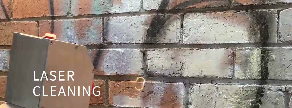 Laser cleaning demonstration on brick wall showing before and after results